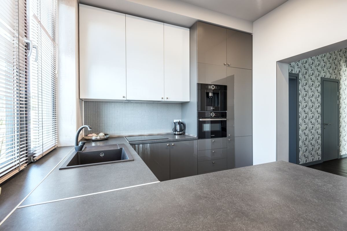 High-gloss modern kitchen cabinets with reflective lacquer finish