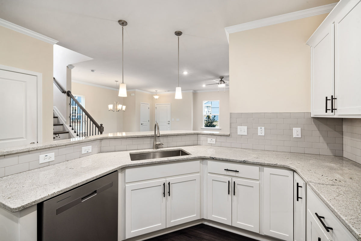 Bright modern kitchen with white cabinets and an island