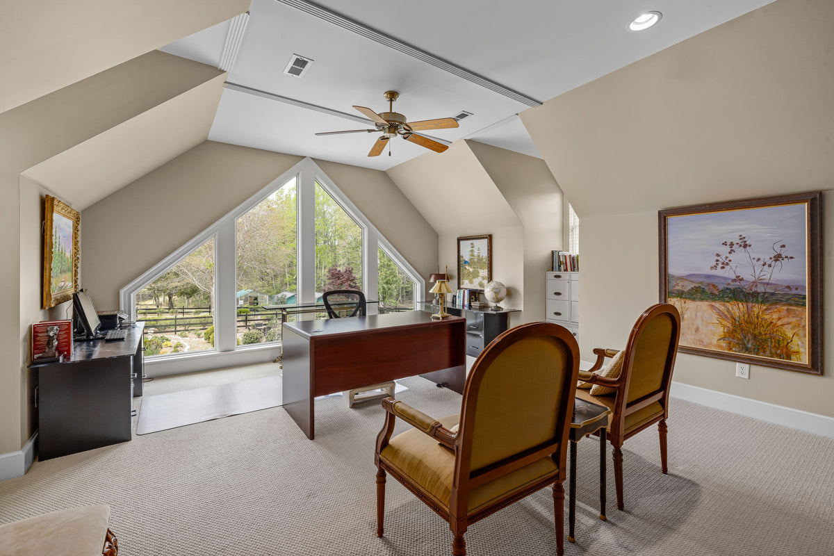 Home office with built-in desk storage and shelving