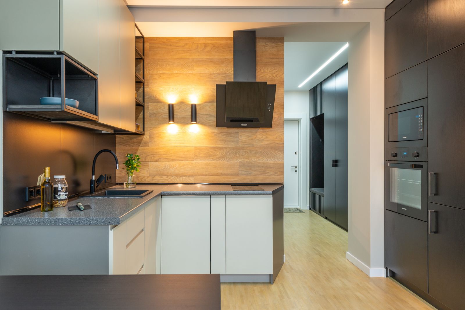 Kitchen cabinetry with built-in appliance integration affecting cost